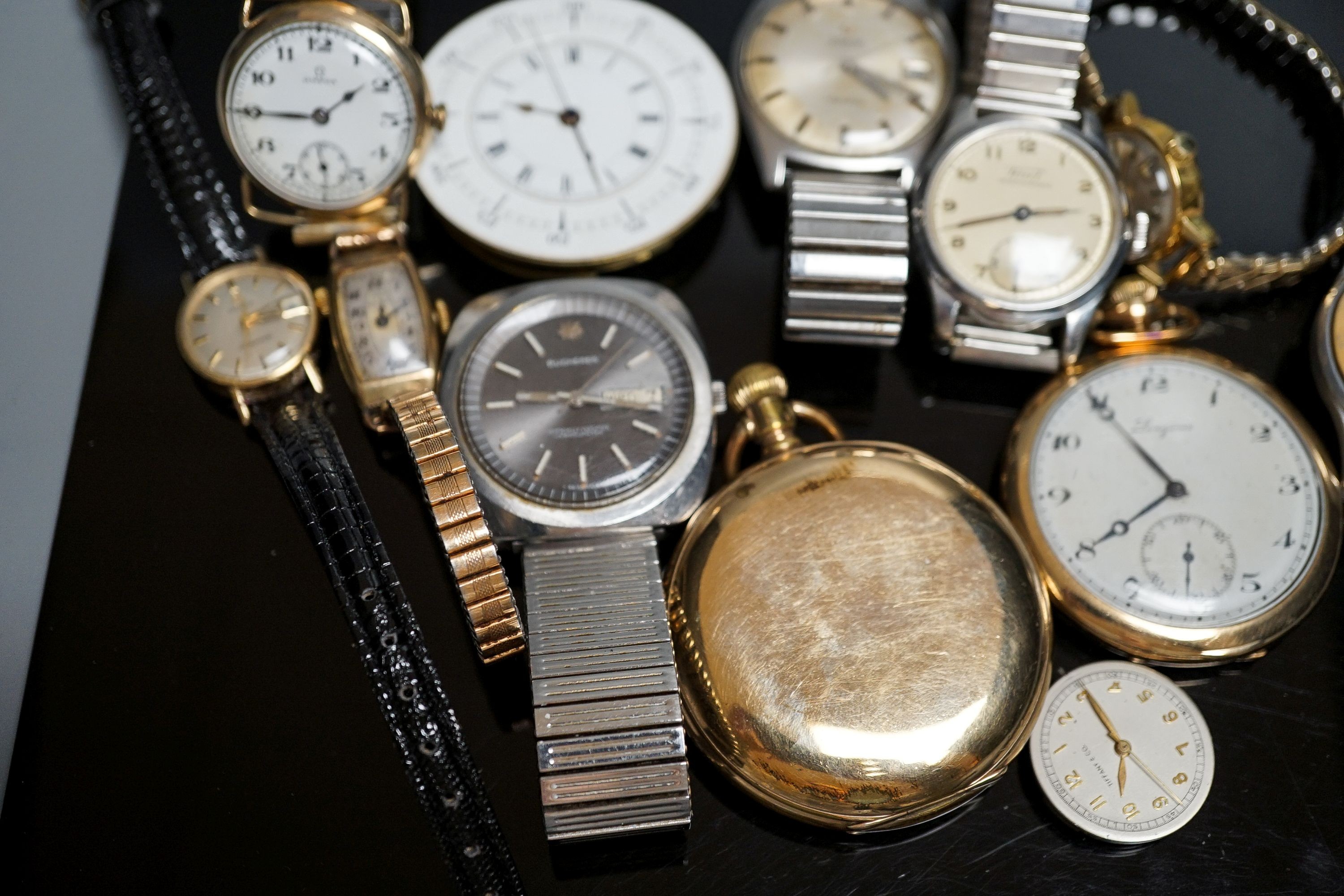 A group of assorted steel or gold plated wrist and pocket watches including six Omega (one military) and one Bucherer watch.